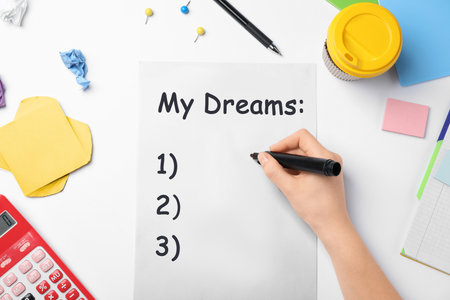 Woman writing dreams at table, top viewの写真素材