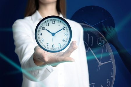 Time management concept. woman with clock closeup