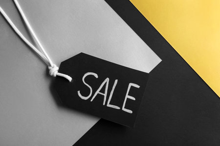 Tag with word SALE on color background, top view. black friday conceptの写真素材