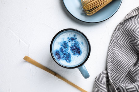 Flat lay composition with blue matcha latte on white tableの写真素材