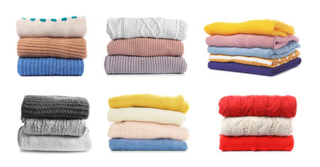 Set of folded and stacked sweaters on white background. banner designの写真素材