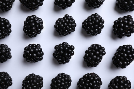 Tasty ripe blackberries on white background, flat layの写真素材