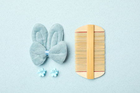 Flat lay composition with wooden hair combo on light backgroundの写真素材