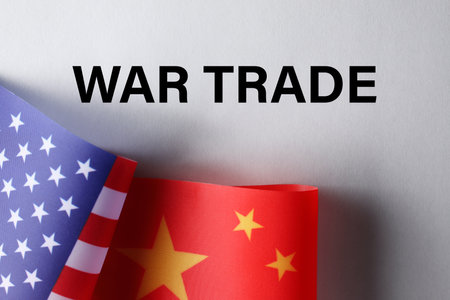 USA and China flags on paper with text WAR TRADE, flat layの写真素材