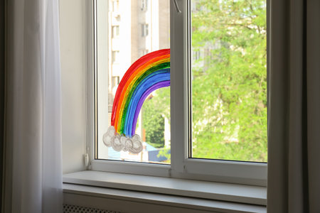 Picture of rainbow on window glass indoors. Stay at home conceptの写真素材