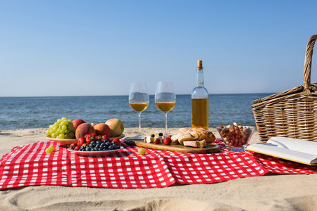 Food and wine on the beach. summer picnicの写真素材