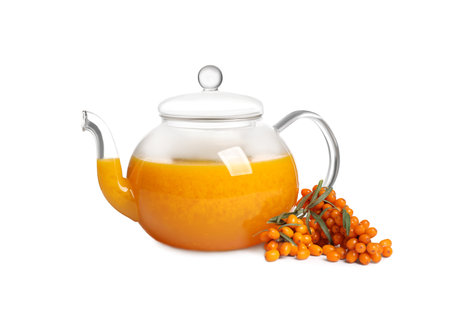 Sea buckthorn tea and fresh berries isolated on whiteの写真素材