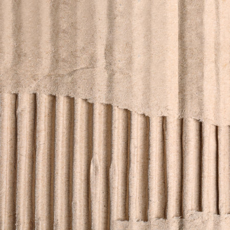 wall paper design. Brown corrugated sheet of cardboard as background