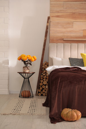 Cozy bedroom interior inspired by autumn color schemeの写真素材