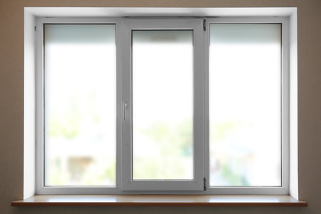 Modern plastic window with empty sill indoorsの写真素材