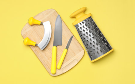Set of modern cooking utensils on yellow background, flat layの写真素材