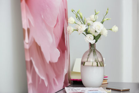 Composition of stylish vase with fresh flowers on gray table indoorsの写真素材