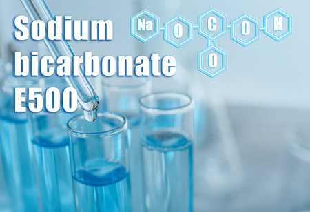 Text Sodium bicarbonate E500 with soda formula and test tubes on backgroundの写真素材