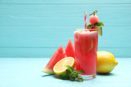 Delicious fresh watermelon drink on light blue wooden table. Space for textの写真素材