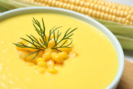 Delicious creamy corn soup on table, closeupの写真素材
