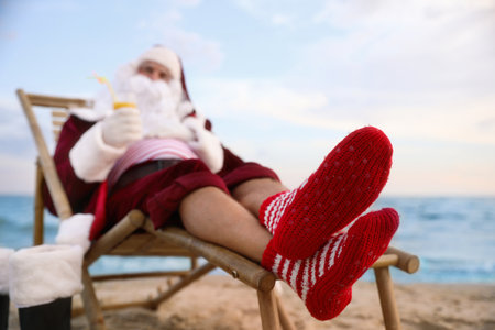 Santa Claus relaxing on the beach. christmas holidaysの写真素材