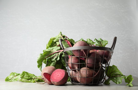 Fresh ripe beets on light gray tableの写真素材