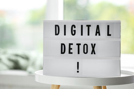 Lightbox with phrase DIGITAL DETOX on white table indoorsの写真素材
