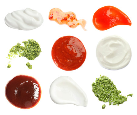 Set with samples of different sauces on white backgroundの写真素材