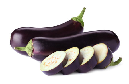 Cut and whole fresh ripe eggplants isolated on whiteの写真素材
