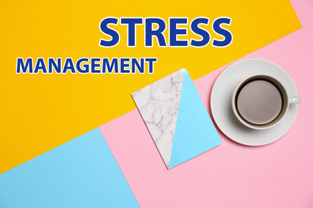 Text Stress Management, notebook and cup of coffee on color background, flat layの写真素材
