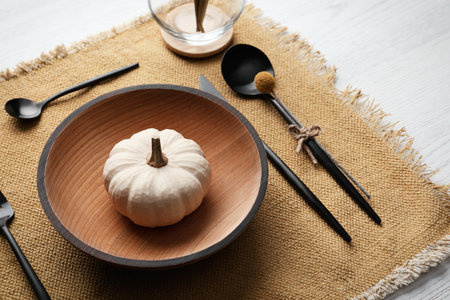 Autumn table setting with pumpkin on white backgroundの写真素材