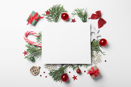 Flat lay composition with Christmas decor and blank card on white background. Space for textの写真素材