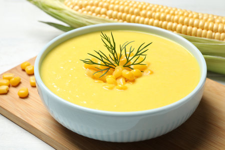 Delicious creamy corn soup on white tableの写真素材