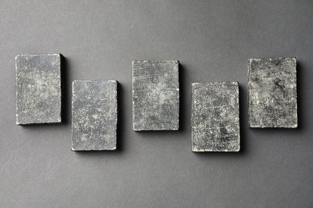 Natural tar soap on black table, flat lay