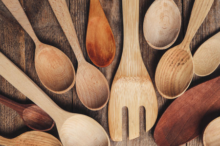 Cooking utensils on wooden table, flat layの写真素材