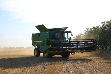 Modern combine harvester in field. agricultural industry