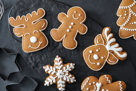 Flat lay composition with delicious homemade Christmas cookies on black table