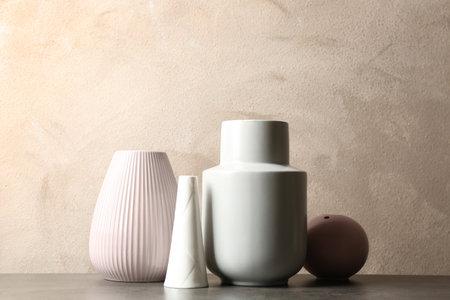 Stylish ceramic vases on gray stone tableの写真素材