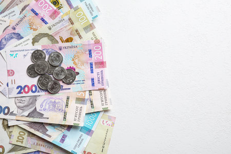 Ukrainian money on white background, flat lay. Space for textの写真素材