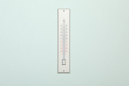 Weather thermometer on white background, top view