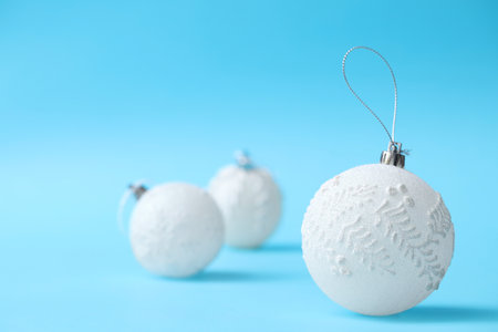 Beautiful Christmas balls on light blue backgroundの写真素材