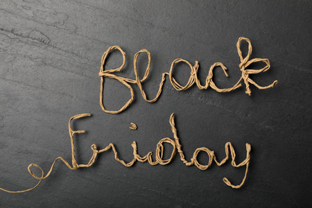 Phrase Black Friday made with rattan rope on dark background, top viewの写真素材