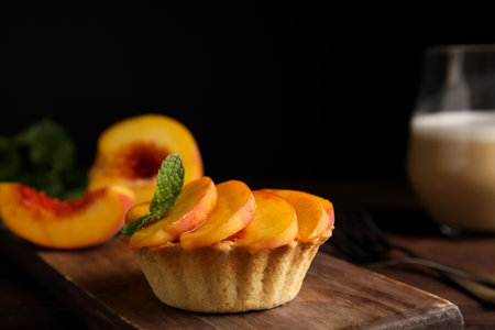 Delicious peach dessert on wooden table, closeupの写真素材