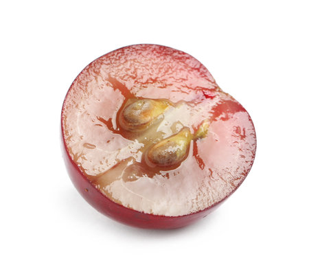 Half of delicious ripe red grape isolated on whiteの写真素材