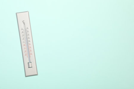 Weather thermometer on light background, top view. Space for textの写真素材