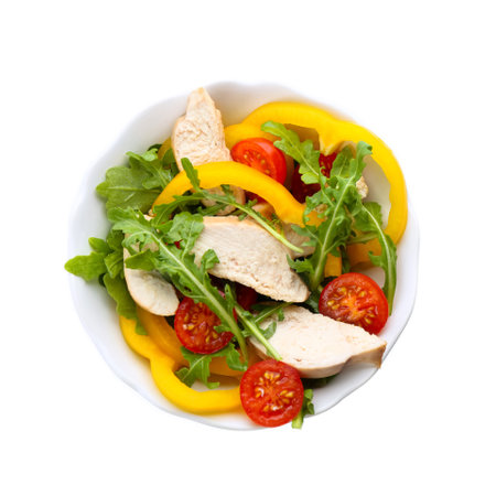 Delicious salad with chicken and vegetables in bowl isolated on white, top viewの写真素材