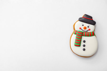 Christmas snowman shaped gingerbread cookie on white background, top viewの写真素材
