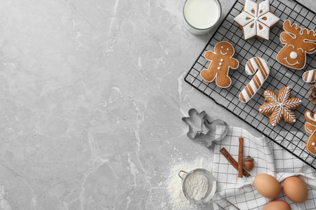 Flat lay composition with delicious homemade Christmas cookies on gray marble table. Space for text