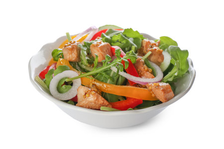 Delicious fresh chicken salad with vegetables and arugula isolated on whiteの写真素材