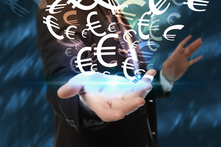 money exchange concept. Businessman with euro currency symbols on blue background, closeupの写真素材