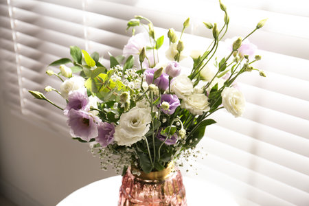 Bouquet of beautiful Eustoma flowers in room, closeupの写真素材