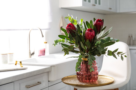 Bouquet with beautiful protea flowers in kitchen, space for text. interior designの写真素材
