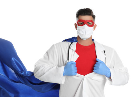 Doctor wearing face mask and cape on white background. Super hero power for medicineの写真素材