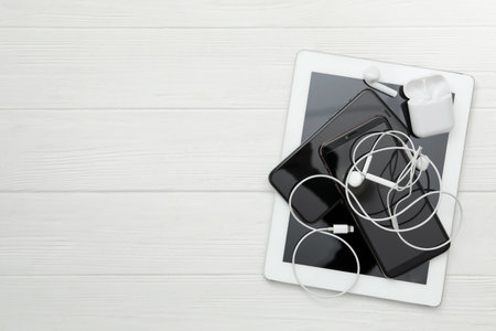 Different gadgets on white wooden table, flat lay with space for text. Digital detox conceptの写真素材