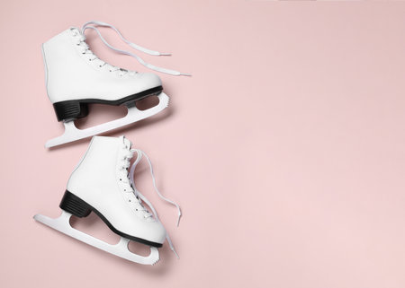 Pair of skates on color background, flat lay. Space for textの写真素材
